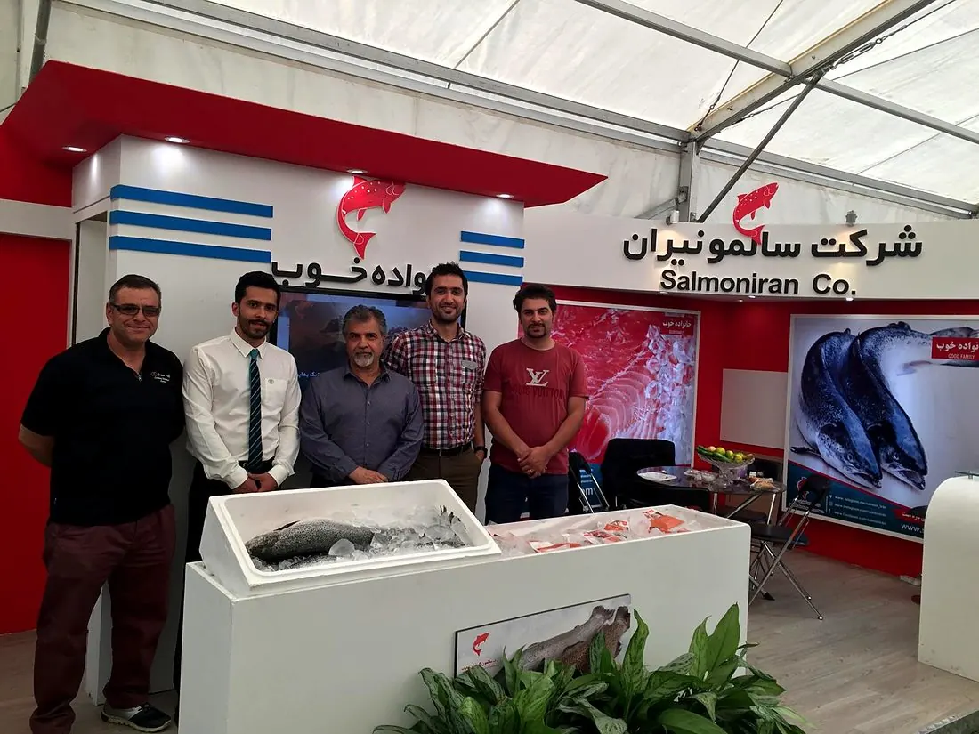 The team at a seafood trade exhibition stand